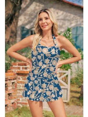 Goldenes Badeanzugkleid mit Blumenmuster und Neckholder im tropischen Resort-Stil